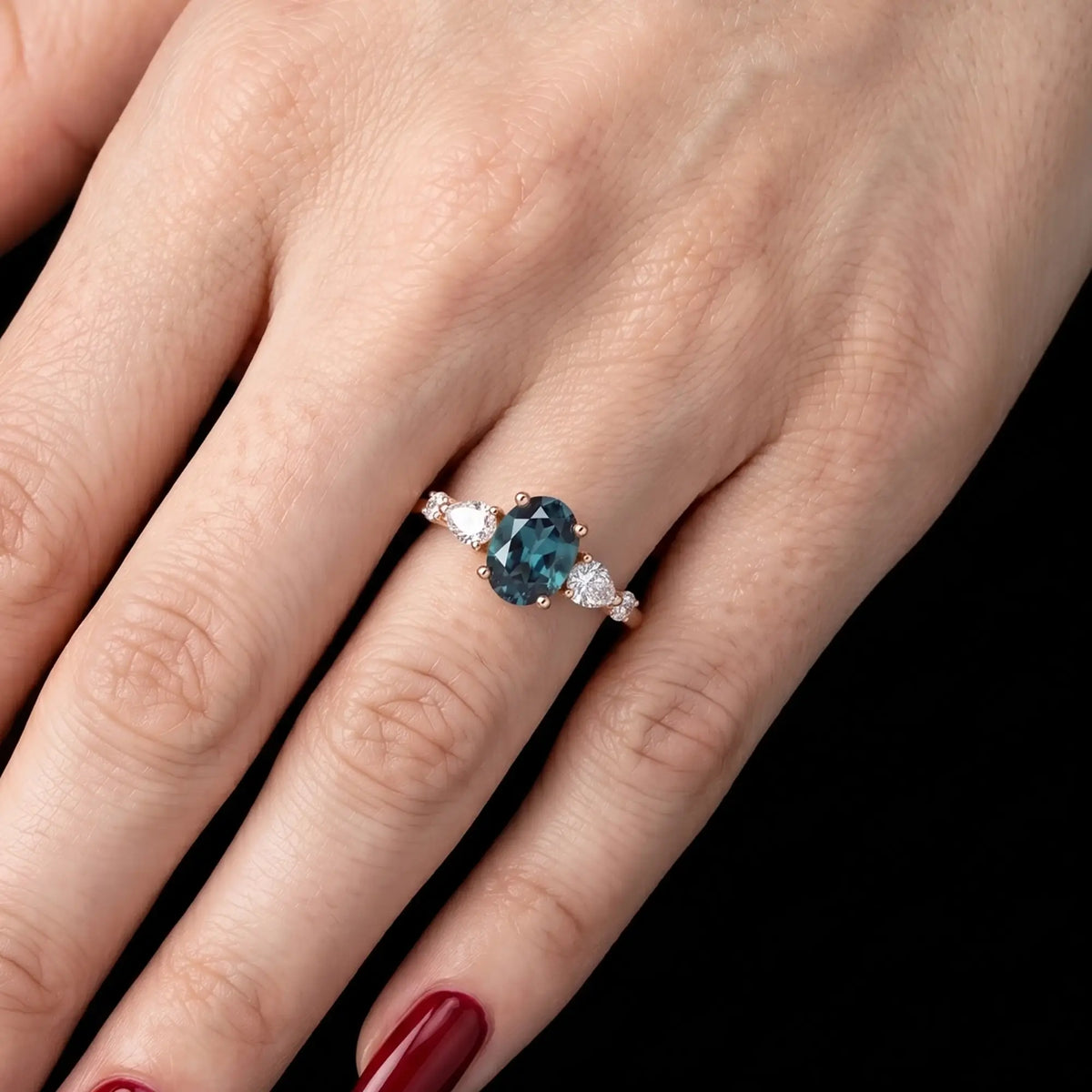 Dainty fine jewelry five-stone oval alexandrite alternative bridal ring shown worn on a woman finger