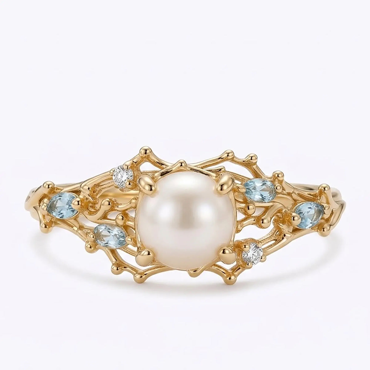 Akoya pearl ocean inspired engagement ring with coral gold details