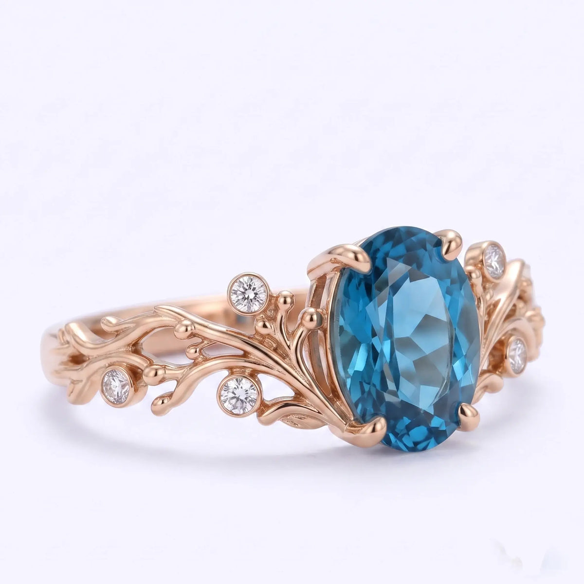 November birthstone ring with oval blue topaz center stone