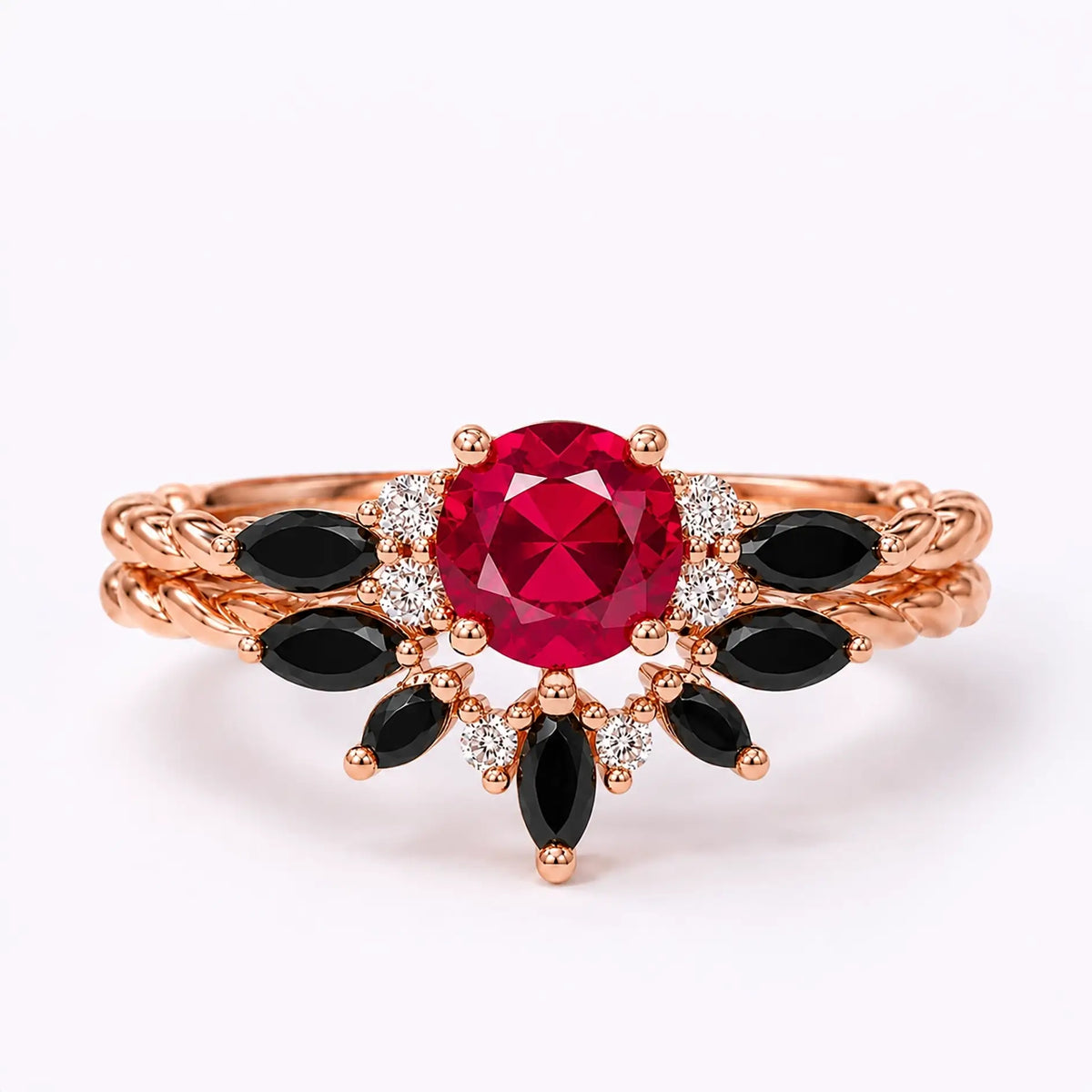 Round ruby engagement ring set with black onyx marquise accents and twisted rose gold bands