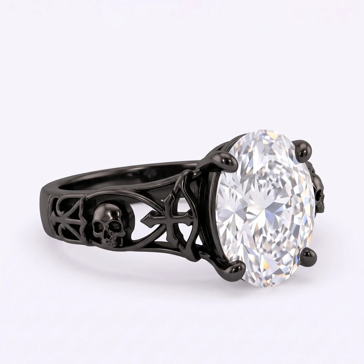Opposite side angle of a black Gothic oval lab diamond solitaire ring highlighting sculpted skull, cross and openwork band details