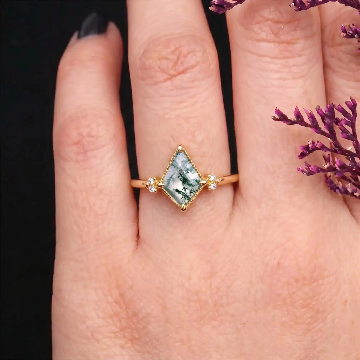Kite moss agate owl engagement ring worn on hand with symbolic vintage design