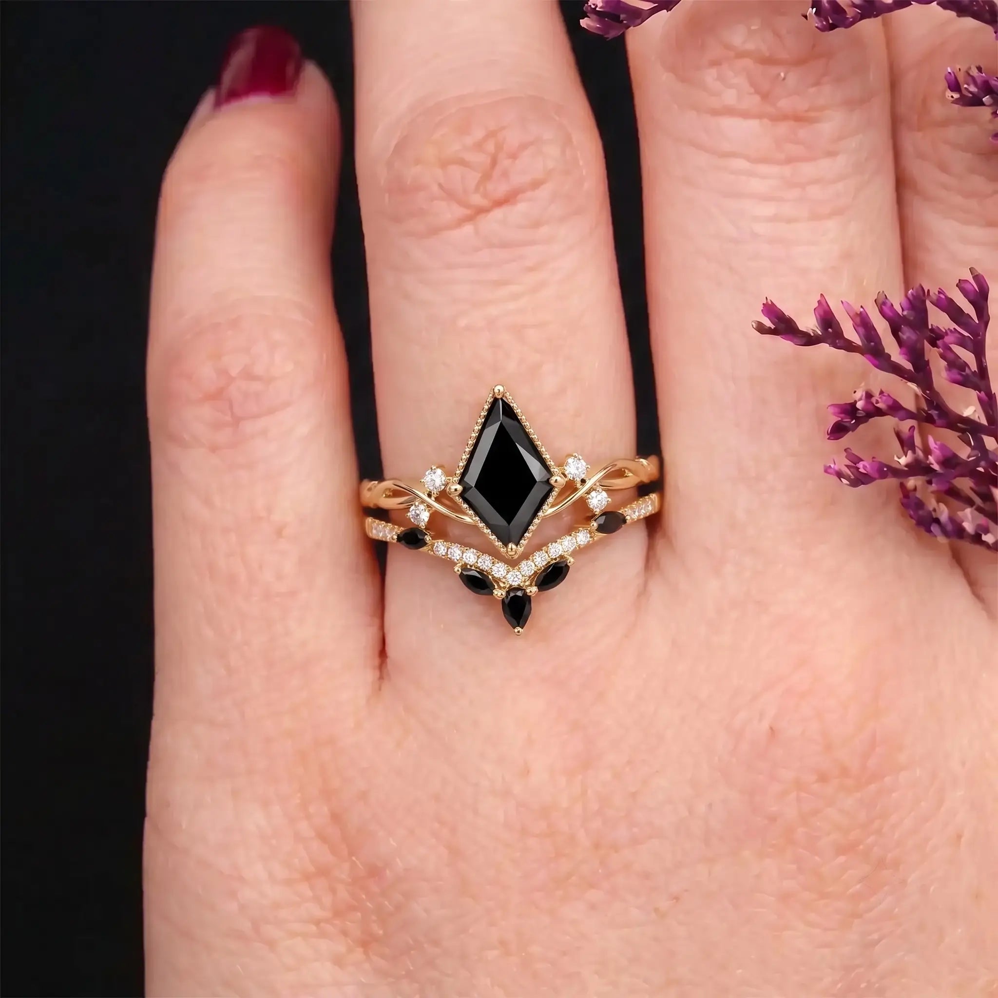 Kite black onyx ring set worn on hand with a modern twisted band design
