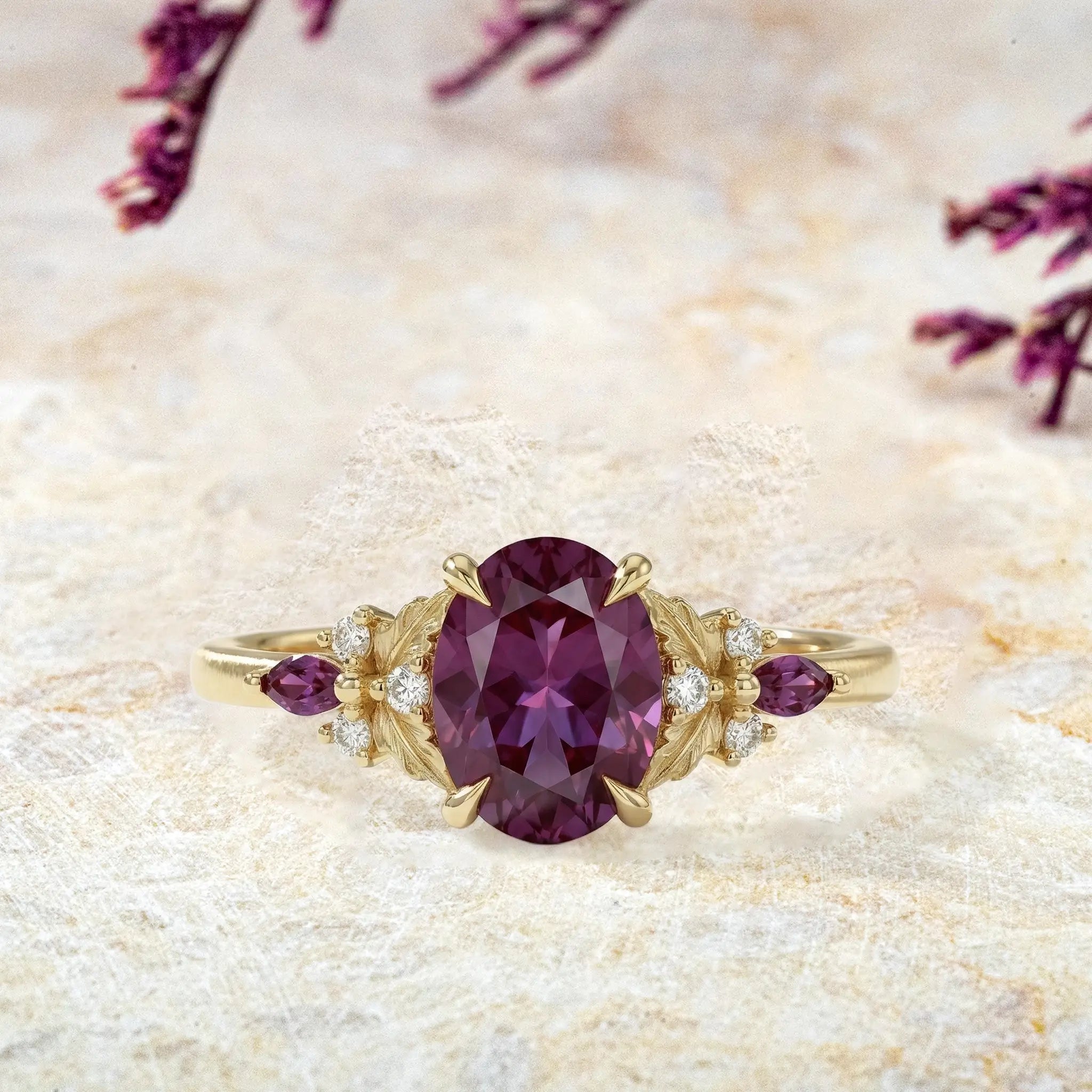 Oval cut alexandrite engagement ring with leaf cluster in solid gold