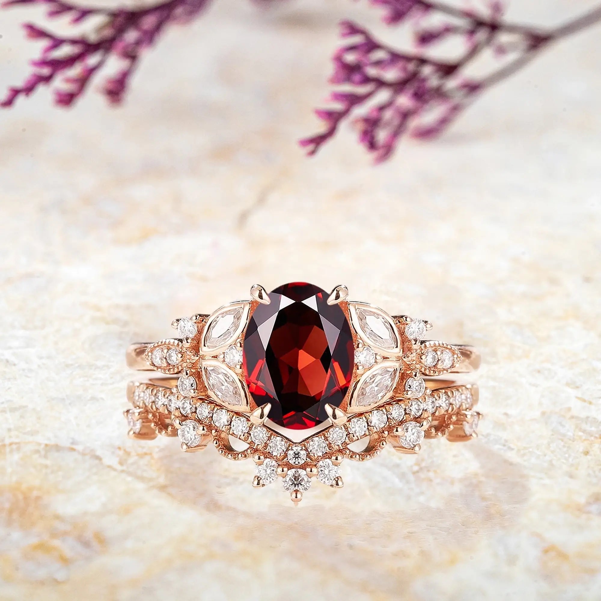 Oval garnet engagement ring with vintage floral cluster in rose gold