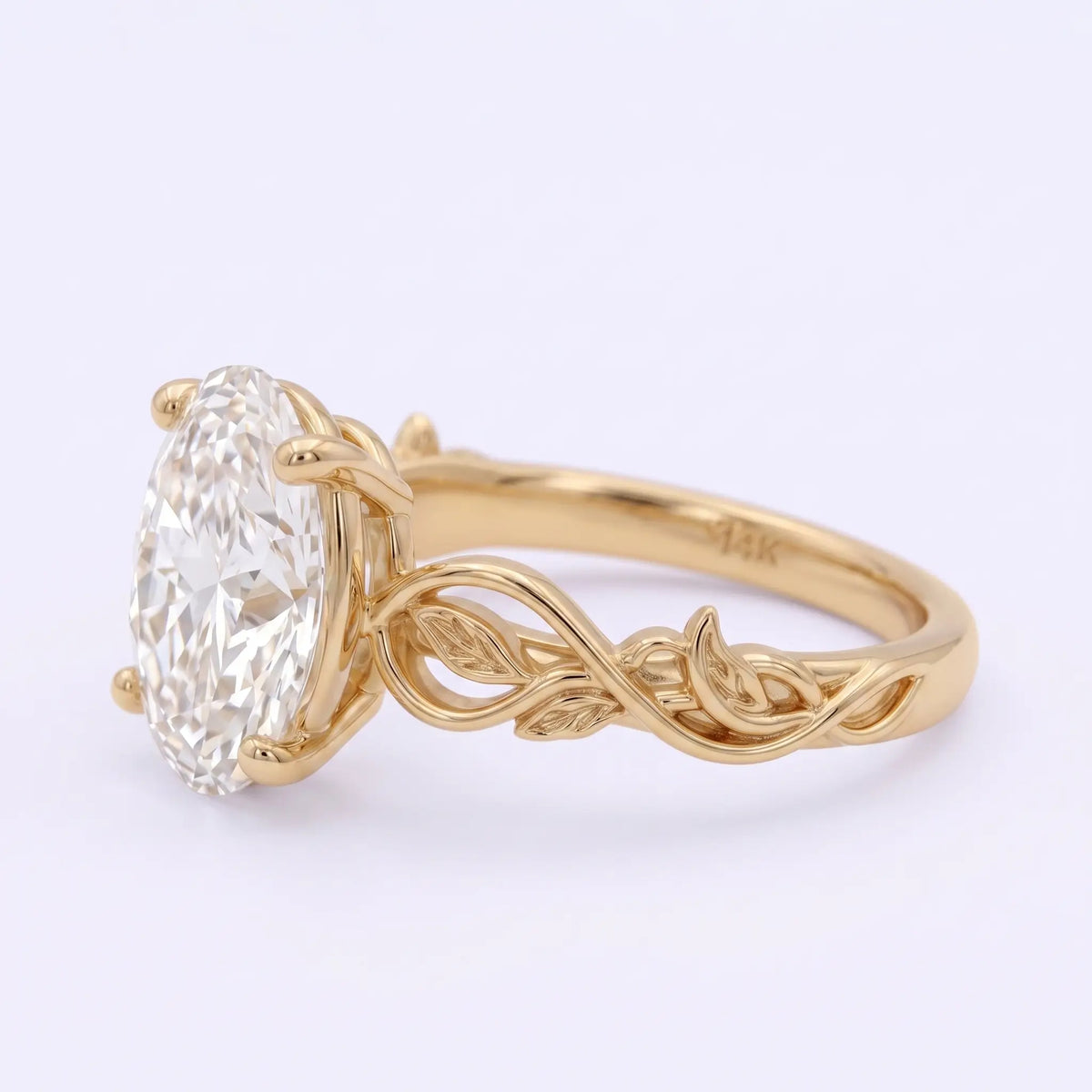 Openwork intertwined vine and leaf details on a nature-inspired engagement ring band