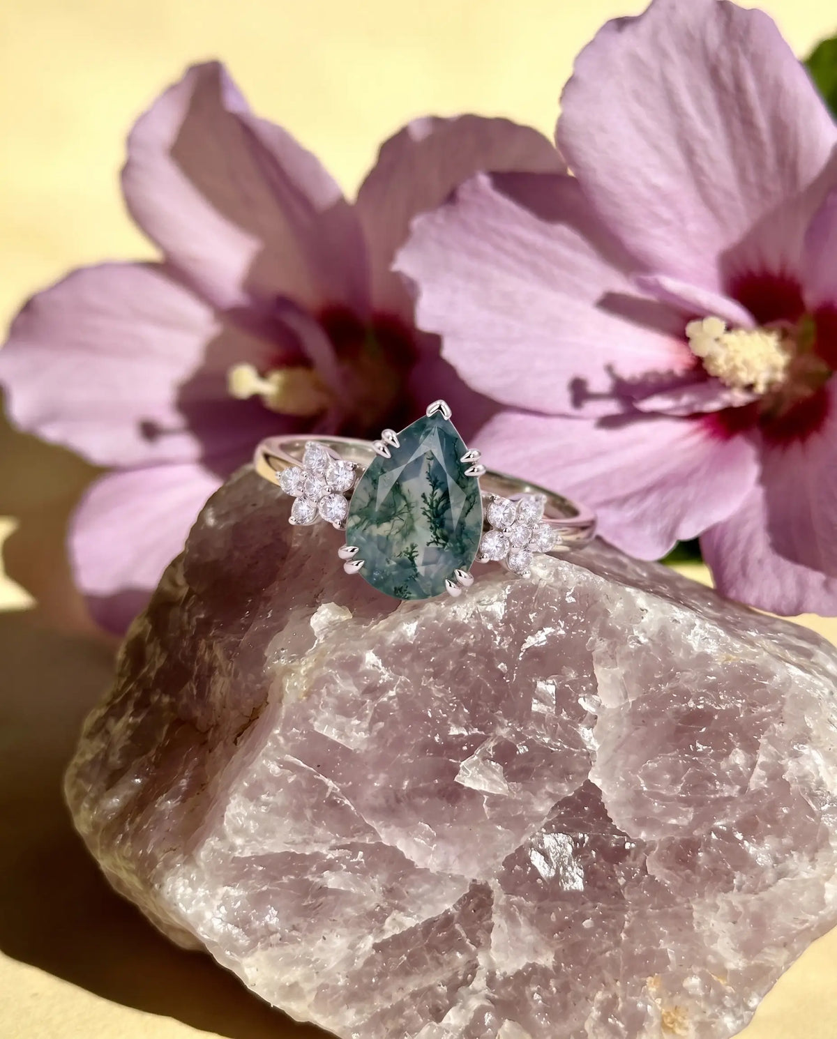 Luxury macro close-up of pear moss agate floral cluster bridal ring placed in an ethereal high-end setting