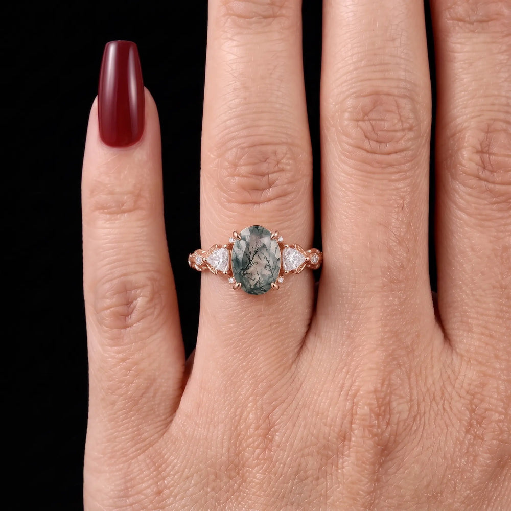 Angle view of oval moss agate botanical engagement ring for women