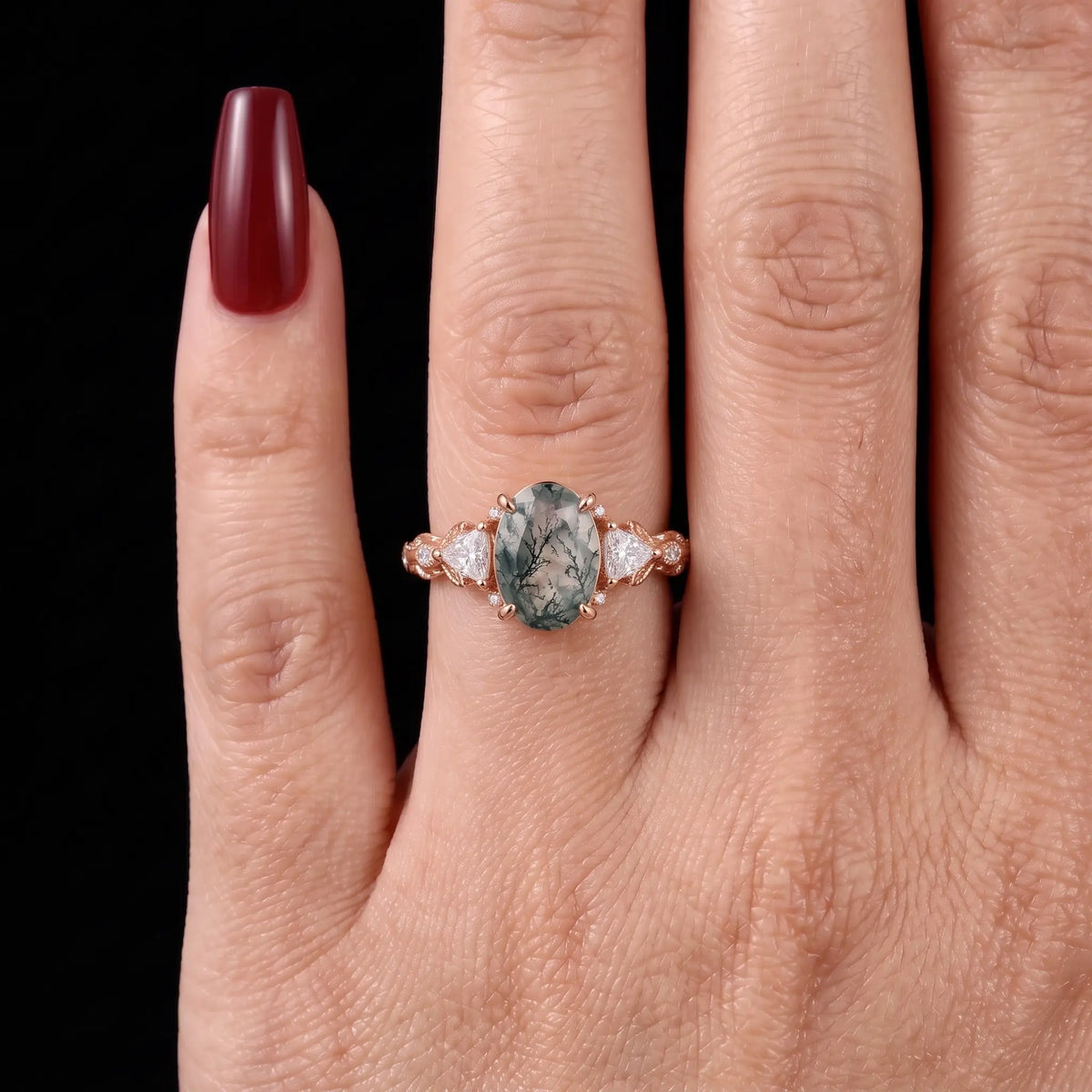 Angle view of oval moss agate botanical engagement ring for women