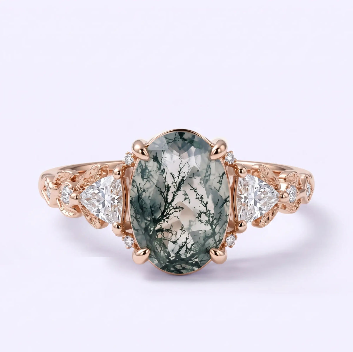 Oval moss agate leaf engagement ring with trillion and round moissanite accents