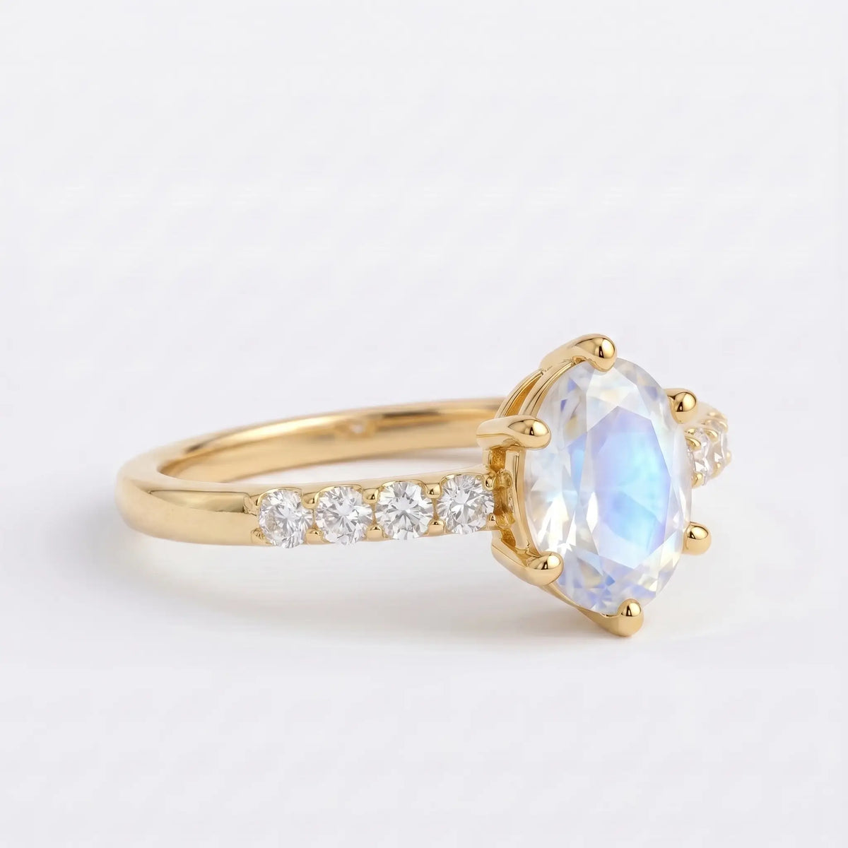 Side view profile of alternative bridal moonstone ring highlighting the elegant low-profile setting
