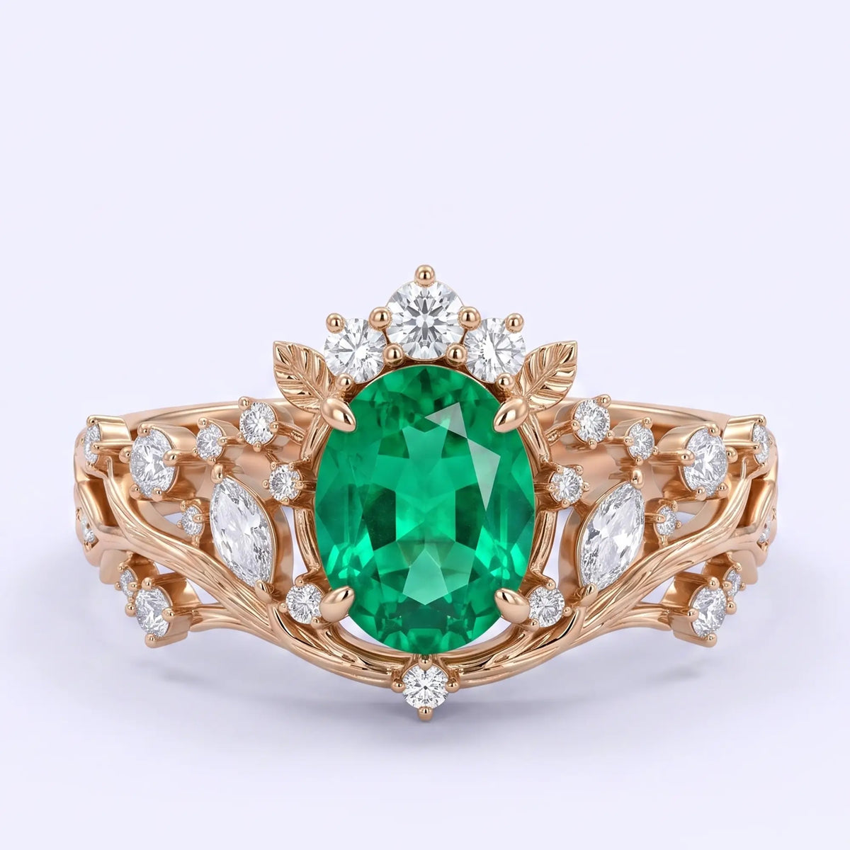 Oval lab emerald woodland engagement ring with leaf and vine details