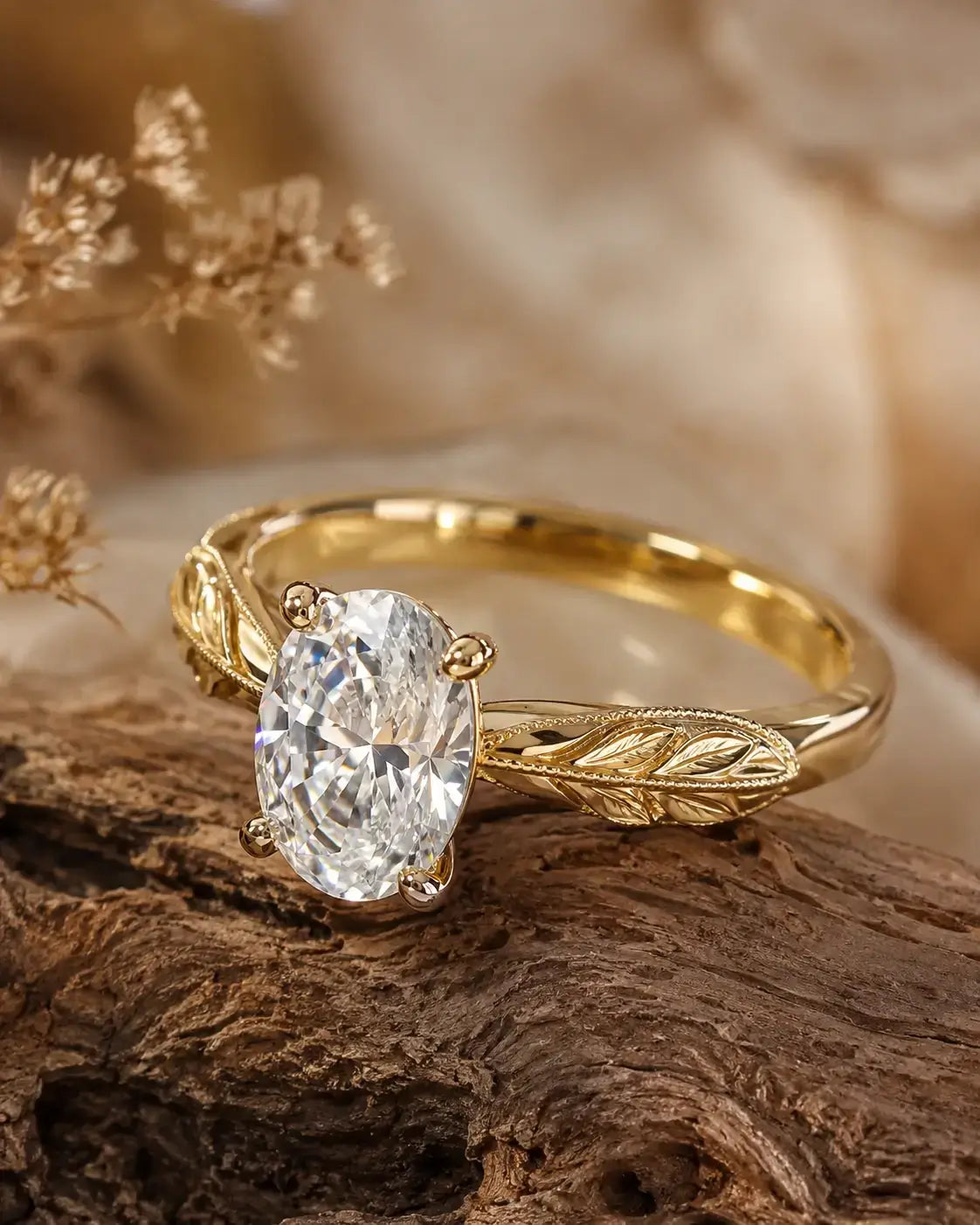 Sculpted leaf detail on the gold band of a nature-inspired engagement ring