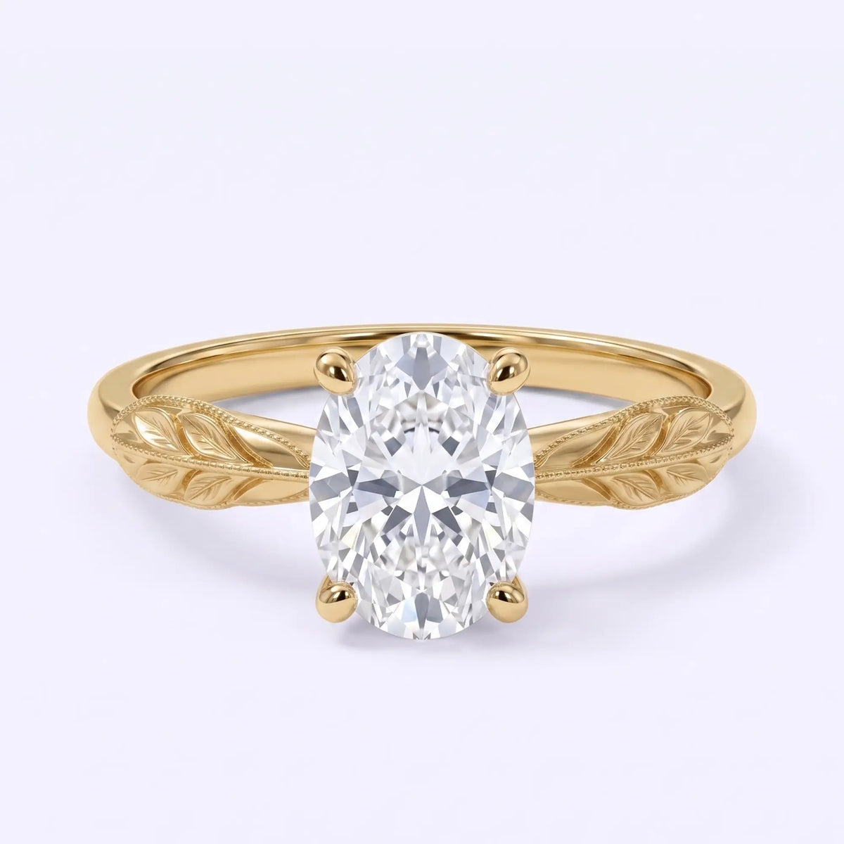 Oval lab-grown diamond solitaire engagement ring with a leaf-inspired gold band