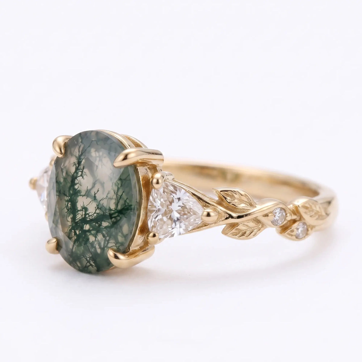 Front view of oval moss agate leaf engagement ring in gold