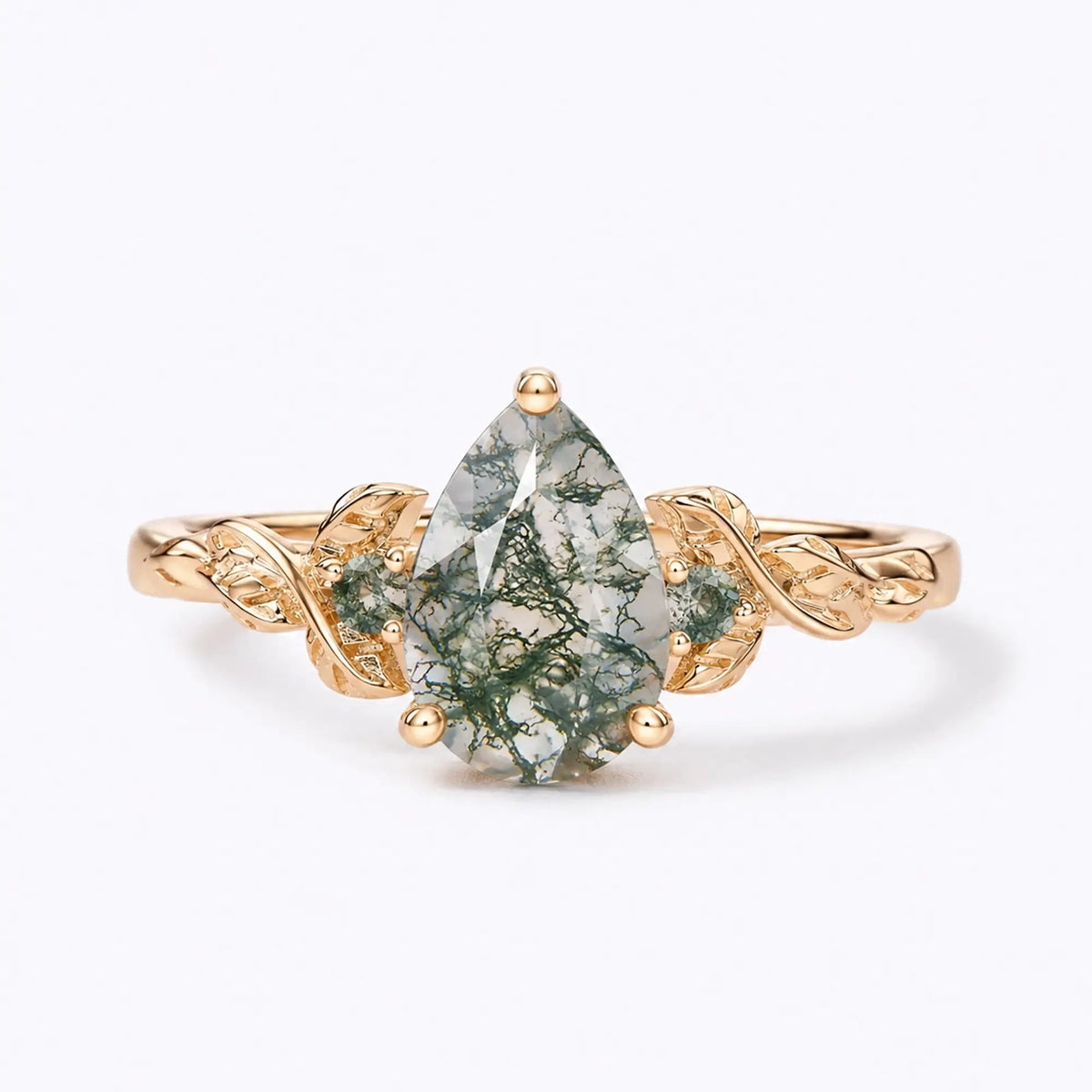 Pear moss agate leaf engagement ring with side stones in yellow gold