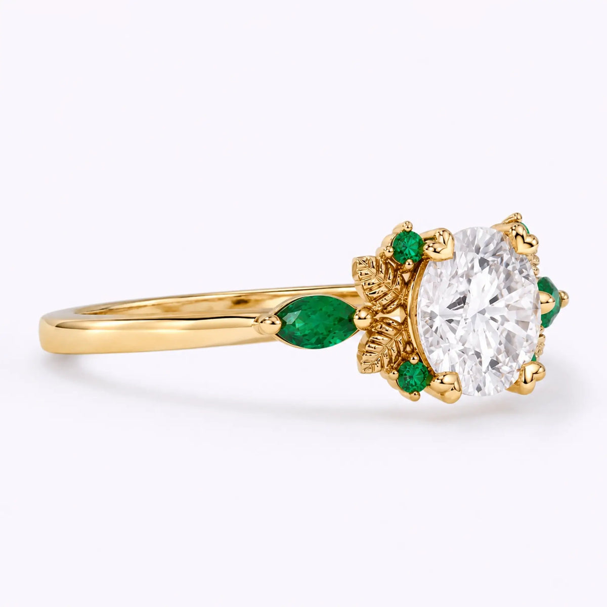 Side view of round moissanite engagement ring showing the slim gold band and leaf details