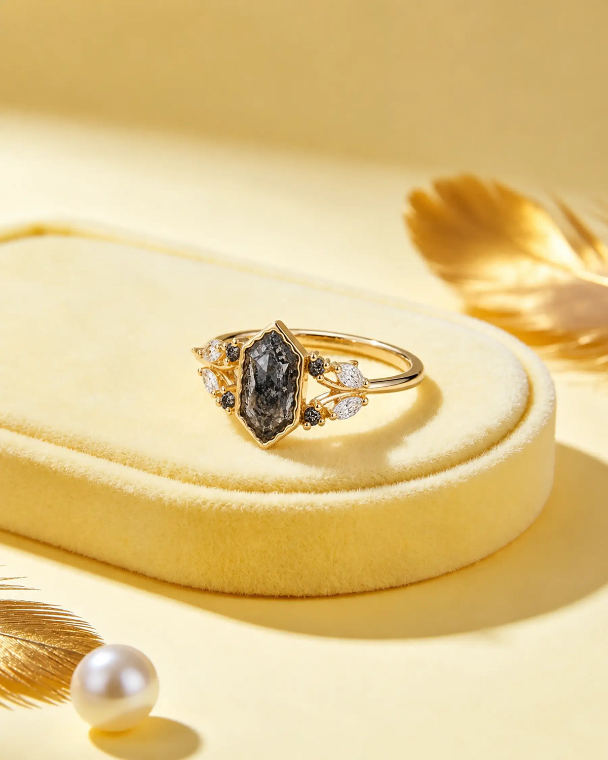 Nature-inspired salt and pepper diamond ring styled in a refined jewelry scene