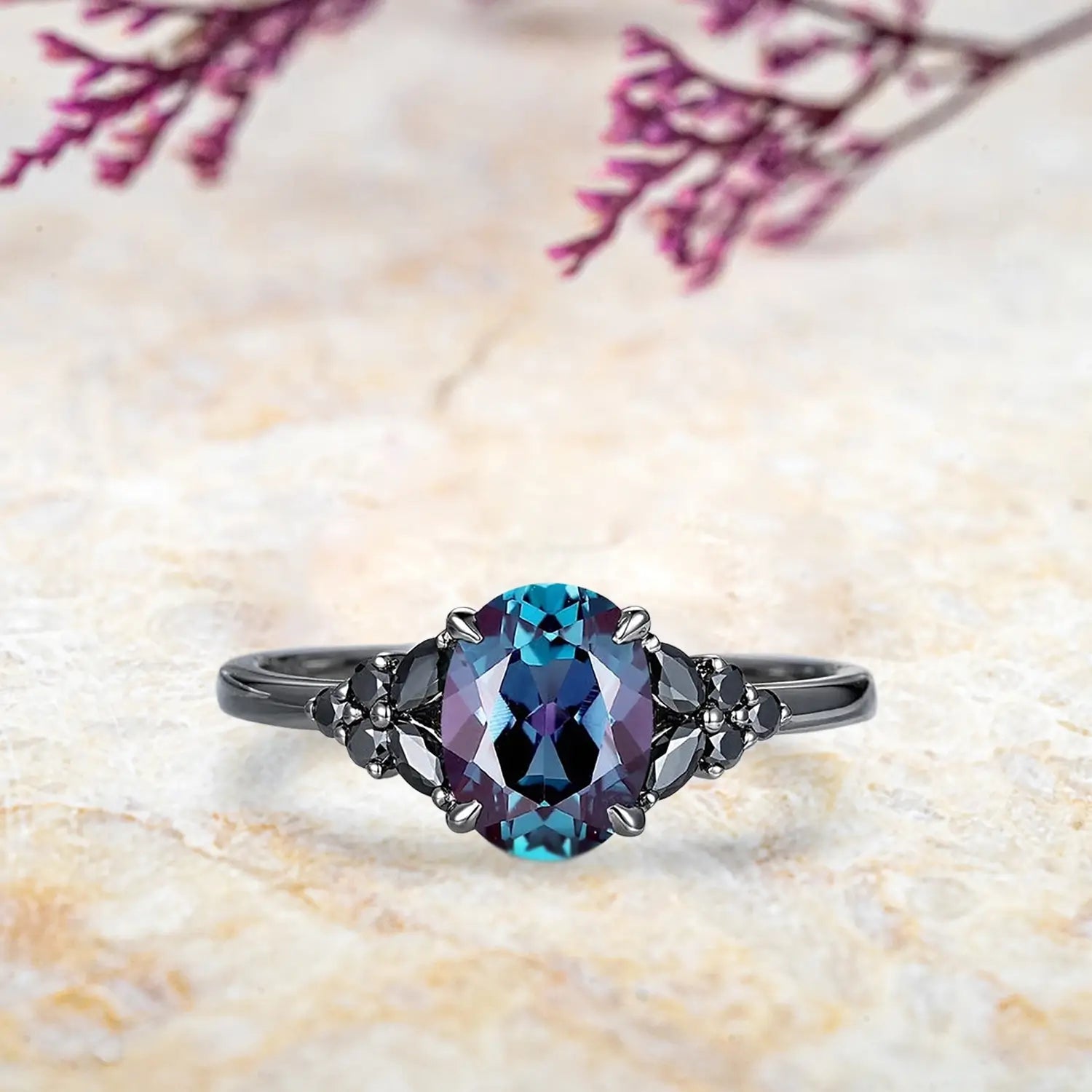 Oval alexandrite engagement ring with black onyx marquise cluster and curved chevron wedding band in black gold