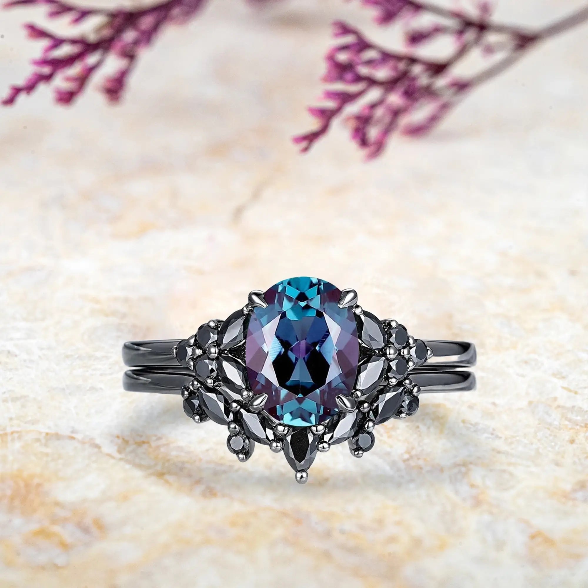 Oval alexandrite engagement ring with black onyx marquise cluster and curved chevron wedding band set in black gold