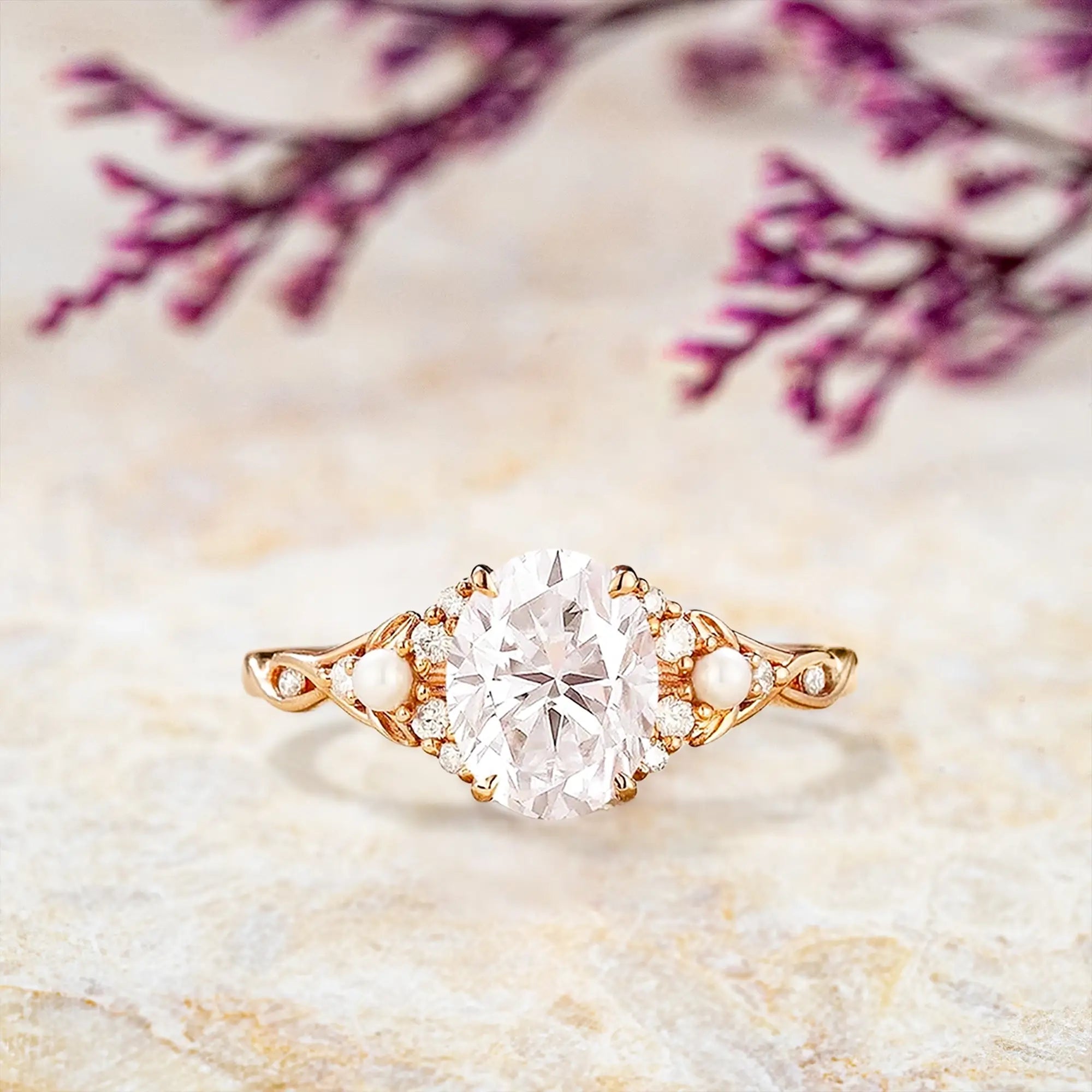 Oval moissanite engagement ring with freshwater pearl cluster and diamond accents on twisted rose gold band