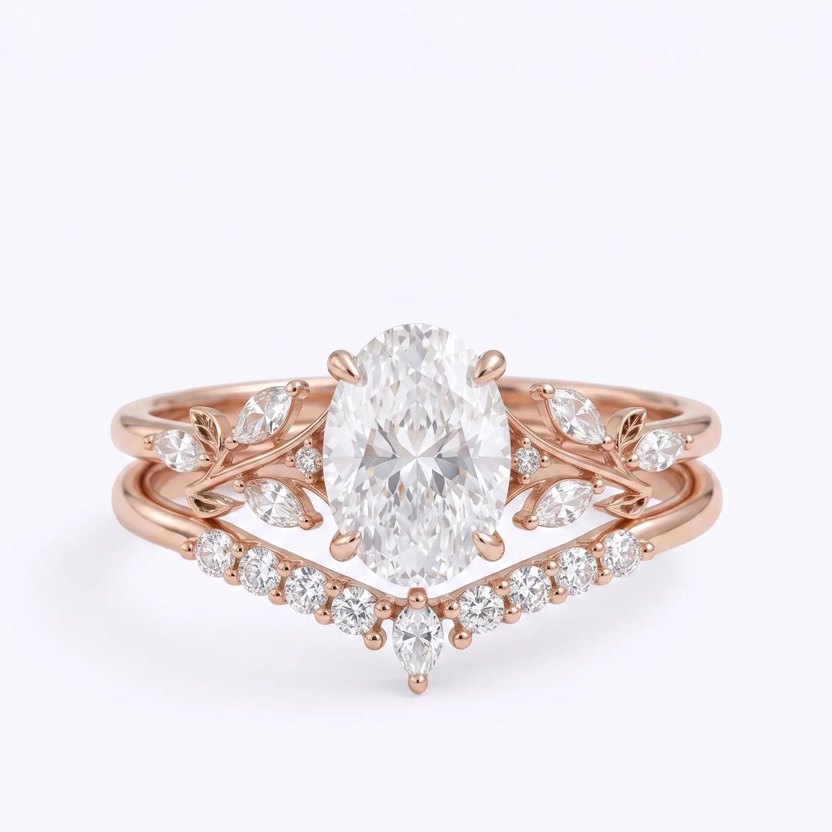Oval cut moissanite leaf bridal ring set in rose gold with curved wedding band