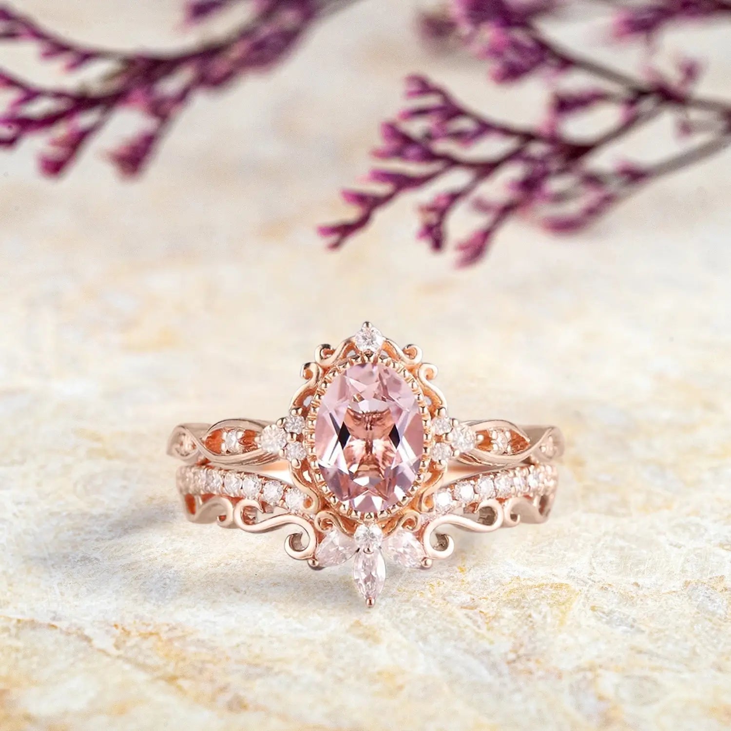 Oval pink morganite engagement ring with vintage crown cluster and curved marquise diamond wedding band set