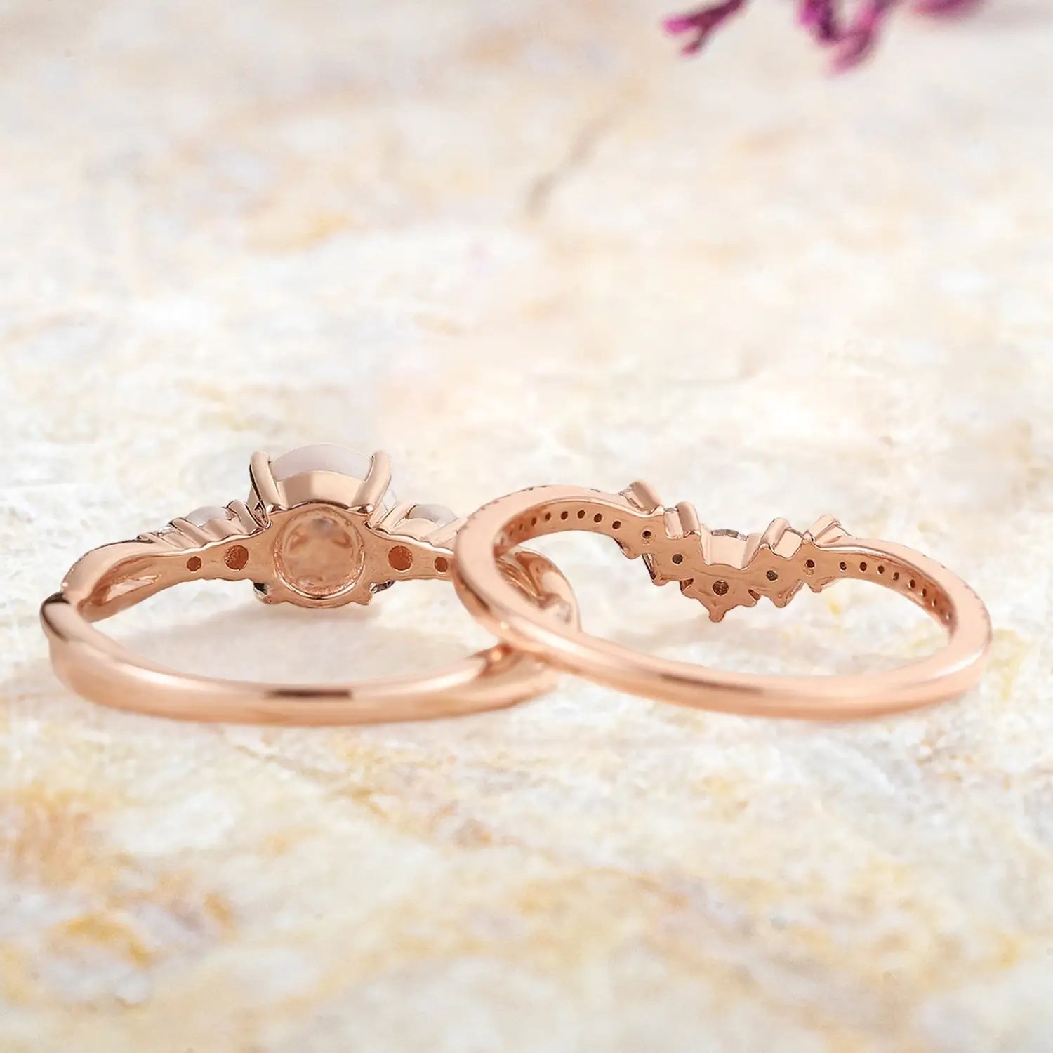 Akoya pearl engagement ring and moissanite wedding band displayed separately