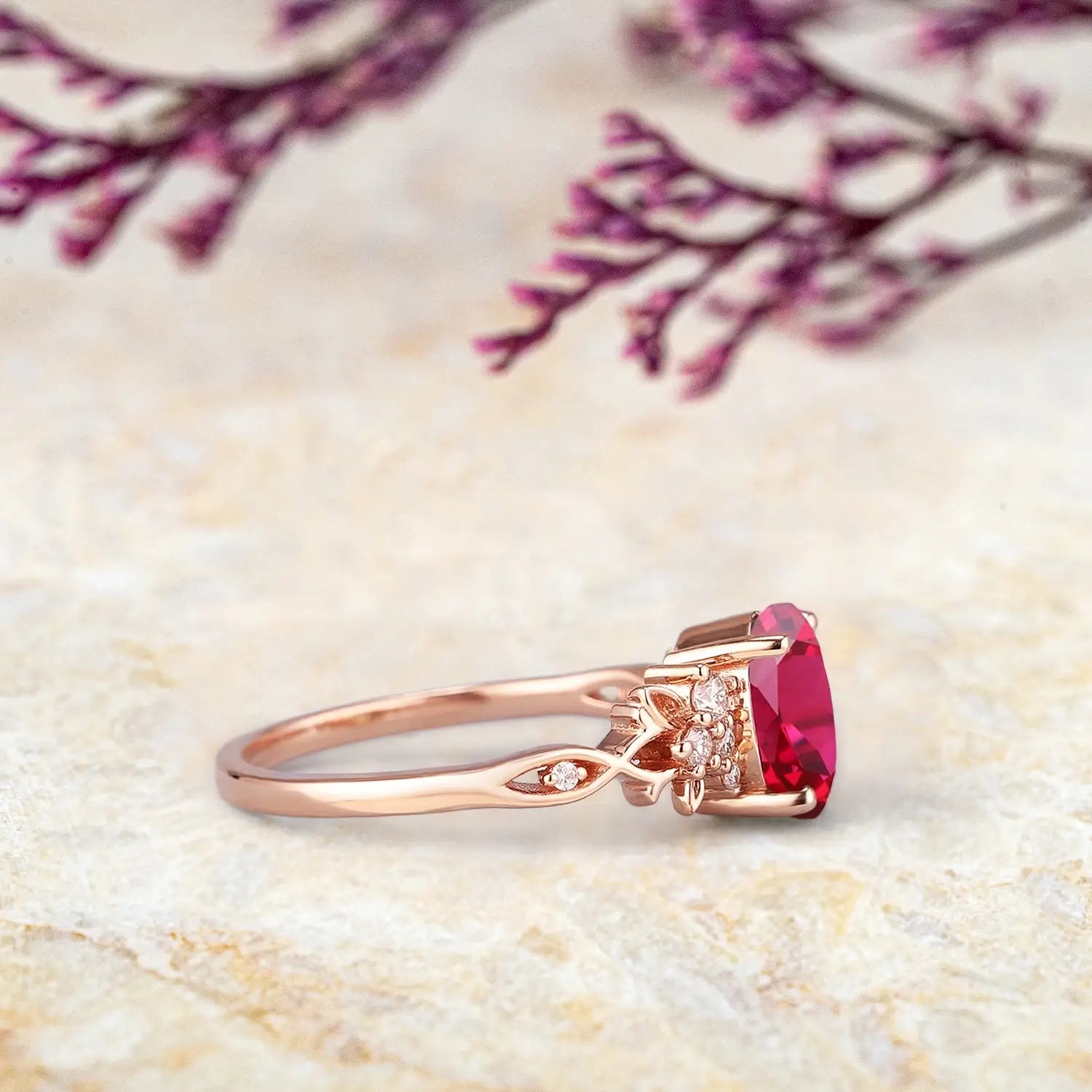 Oval lab ruby engagement ring in 14k gold with moissanite side stones