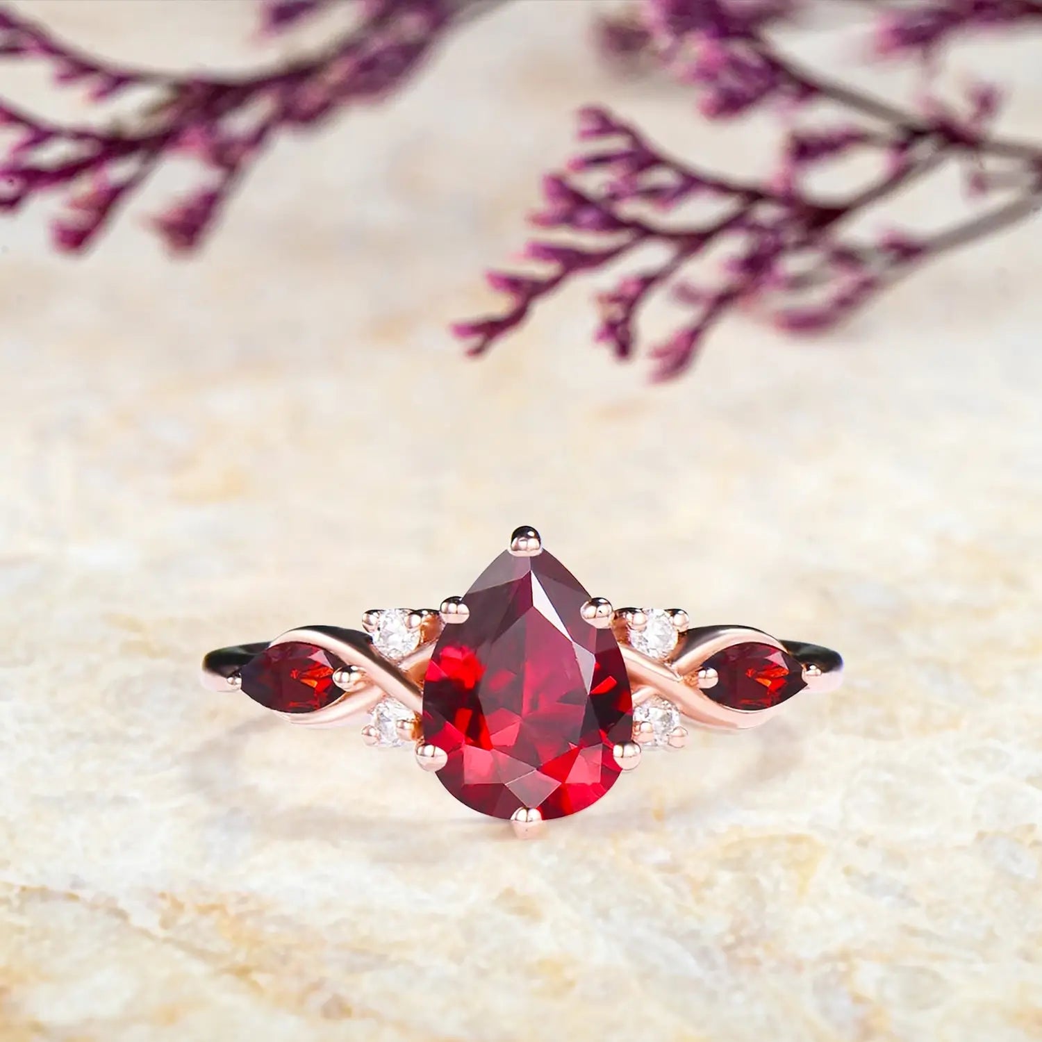pear ruby ring showing marquise cluster design
