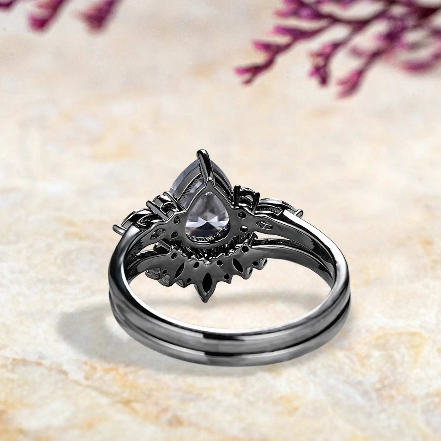 Back view of unique gray moissanite engagement ring set showing marquise cluster and chevron sunburst band craftsmanship