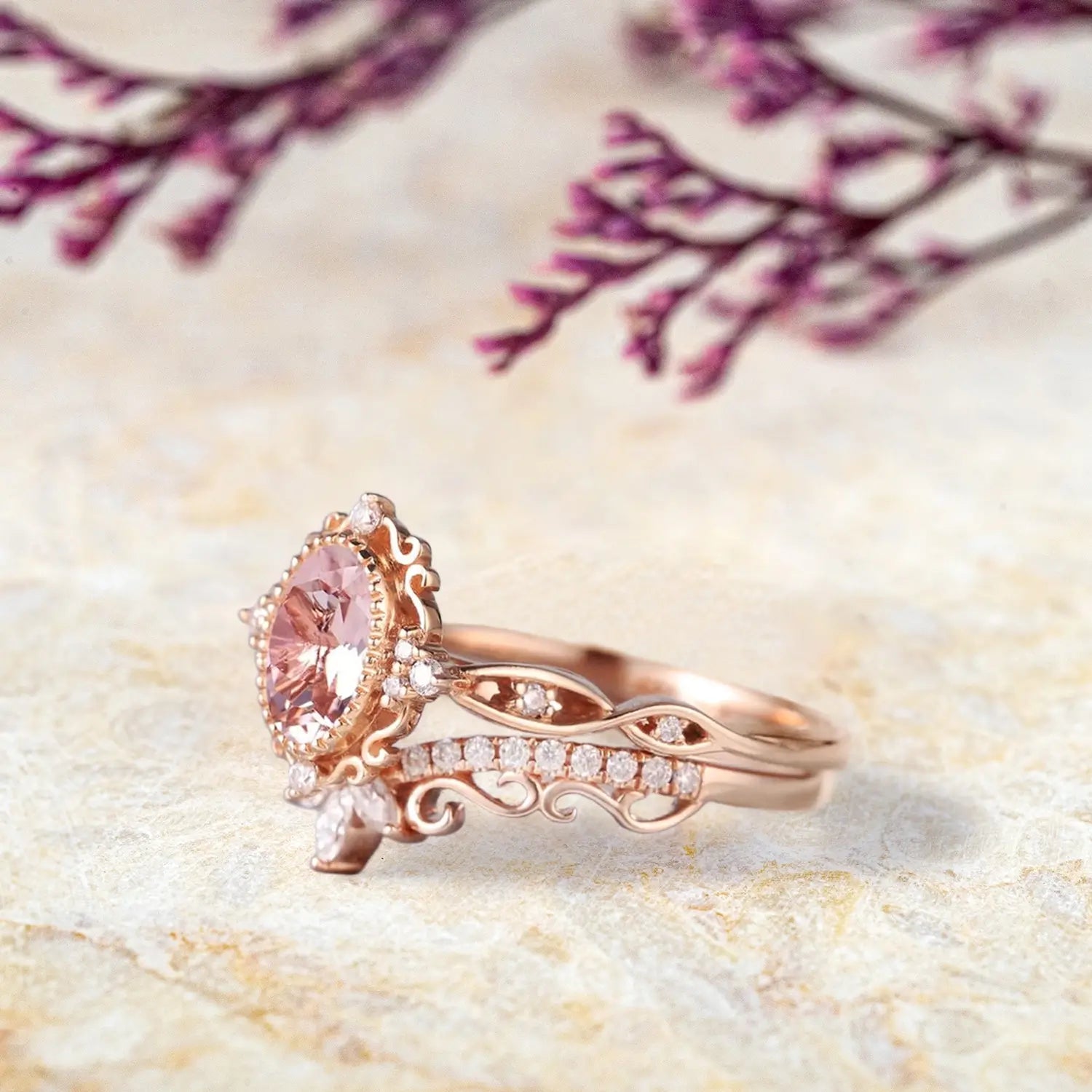 Oval morganite crown ring and curved marquise wedding band displayed separately showing vintage bridal set