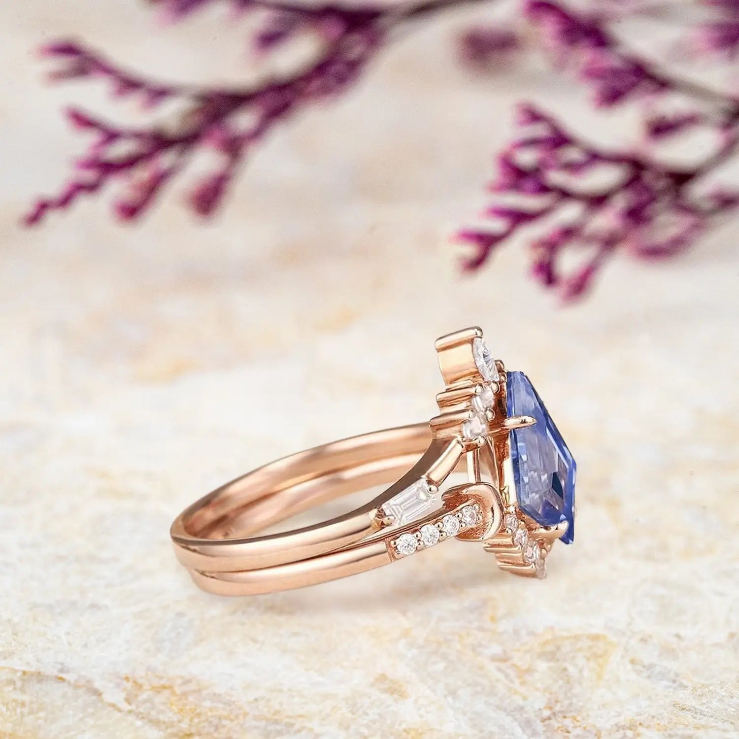 Side view of kite sapphire engagement ring showing tiara cluster design and curved moon baguette band profile