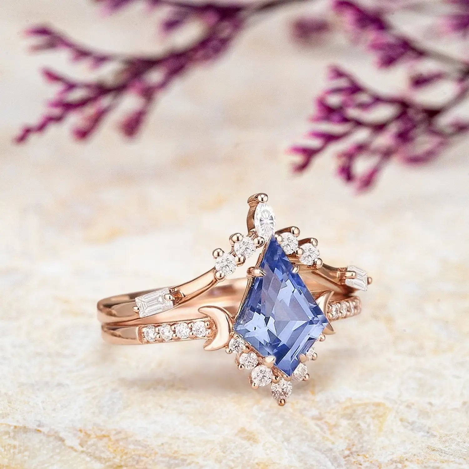 Side view of kite sapphire engagement ring showing tiara cluster design and curved moon baguette band profile