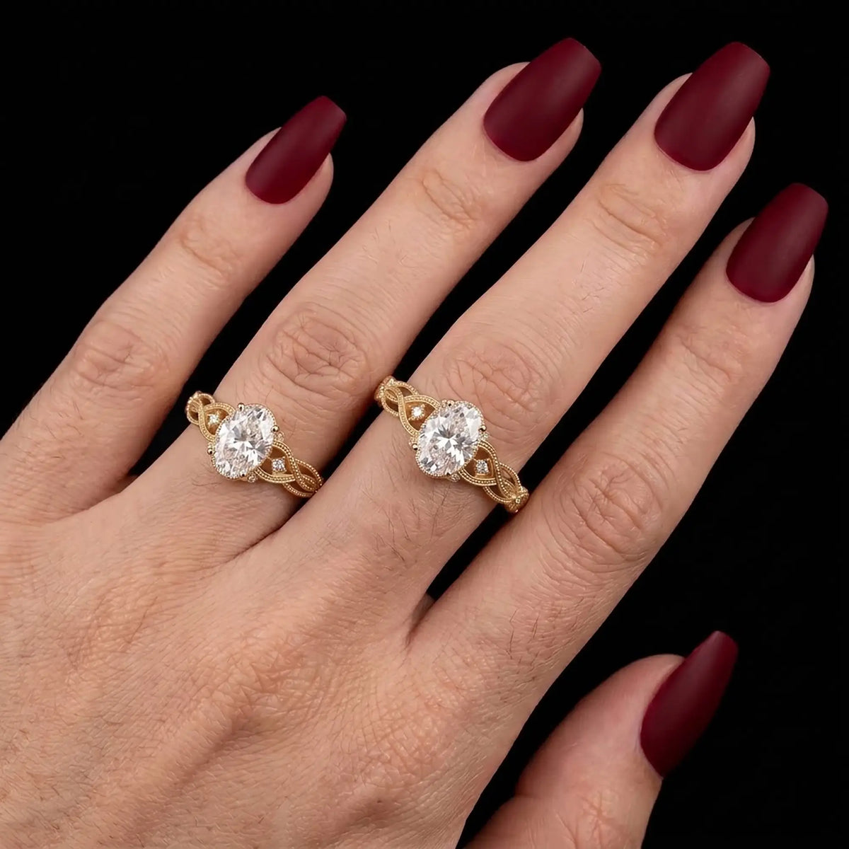 Virelisse oval moissanite engagement ring worn on a finger, showing its elegant proportions and delicate twisted openwork gold band.