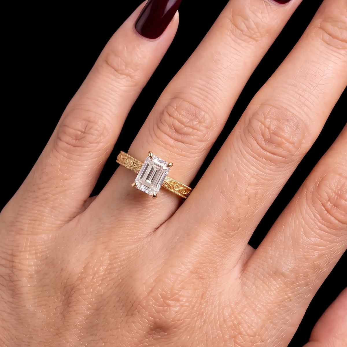 Virelle emerald-cut diamond engagement ring worn on hand