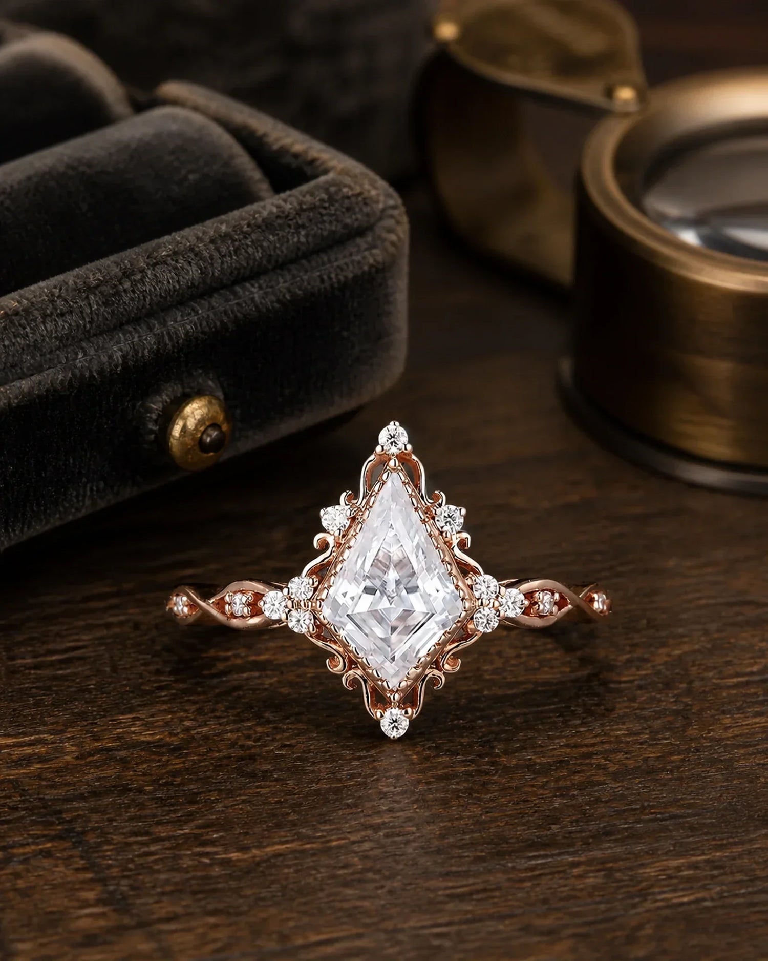 Vintage kite moissanite cluster ring photographed on dark walnut beside an antique jeweler's tray