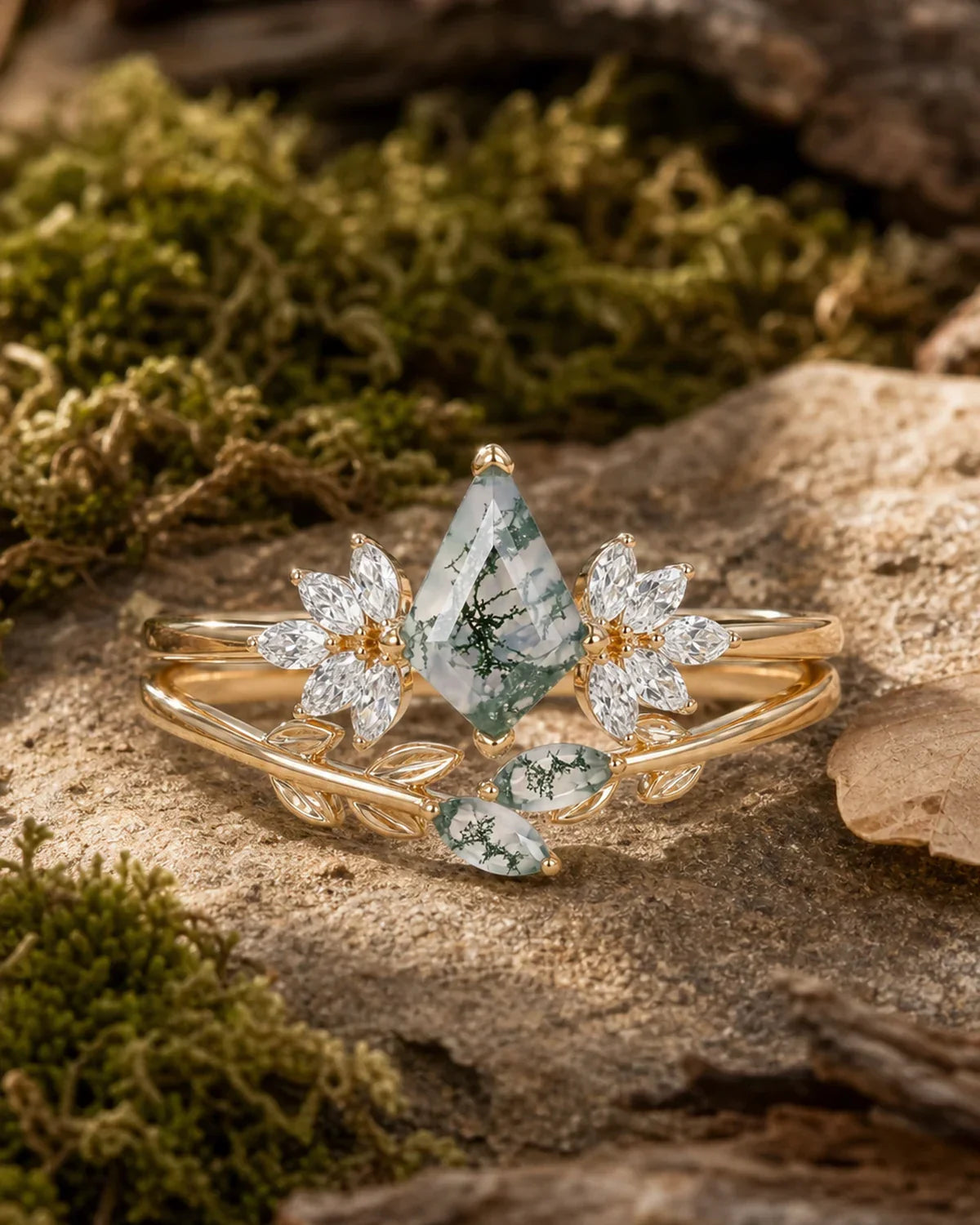 Woodland moss agate leaf engagement ring set on moss and bark