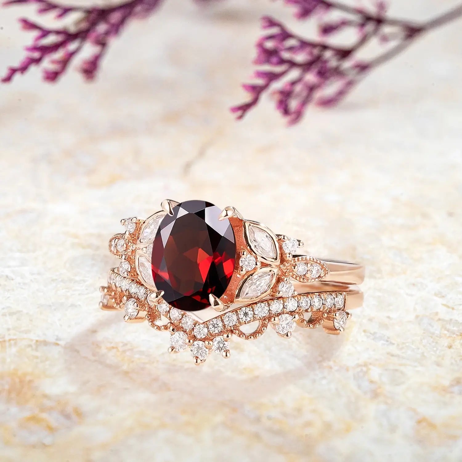 Side view of garnet engagement ring with moissanite accents