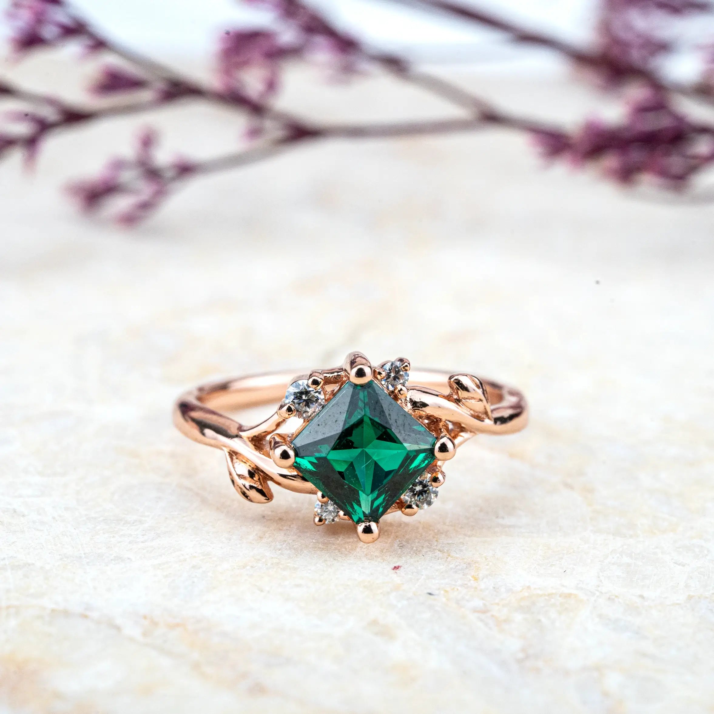 Nature-inspired engagement ring with a vibrant Princess Cut Lab Emerald and moissanite accents