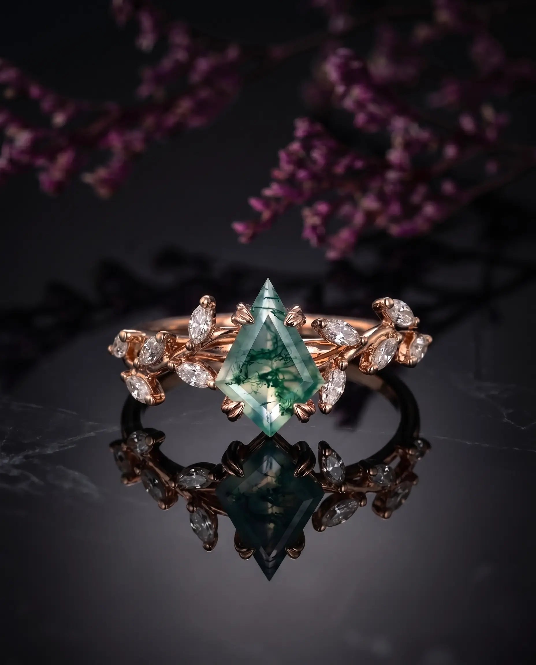 Woman wearing kite moss agate rose gold engagement ring with leaf design