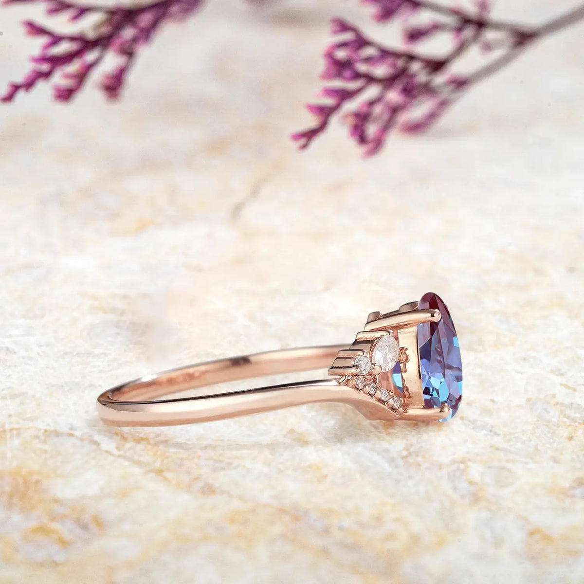 Side view of alexandrite cluster ring showing rose gold split shank and pavé details