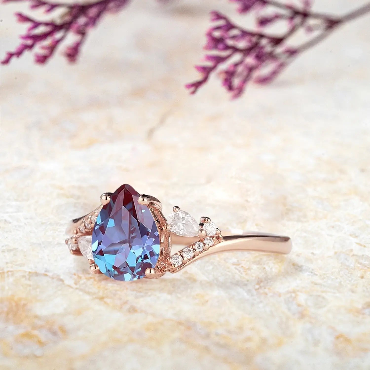 Side view of alexandrite cluster ring showing rose gold split shank and pavé details