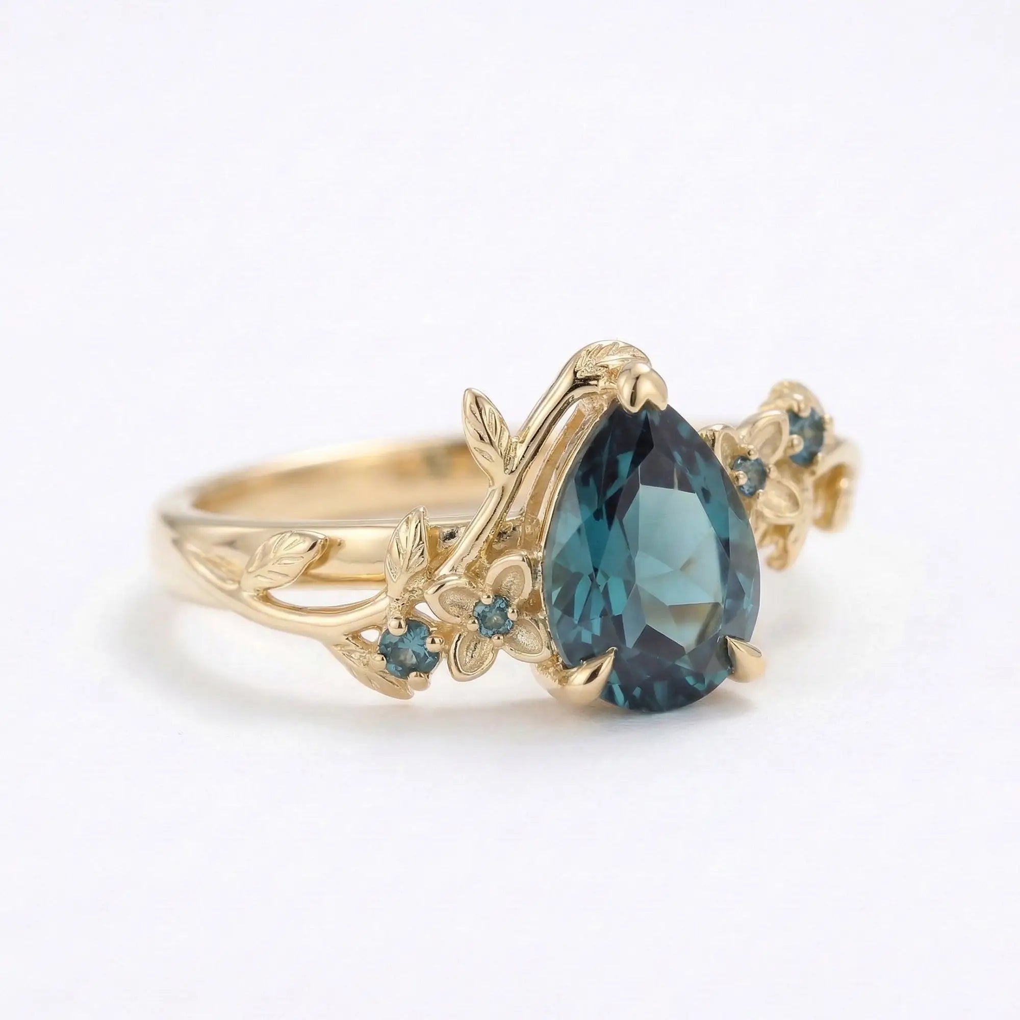 Nature inspired pear cut alexandrite flower engagement ring