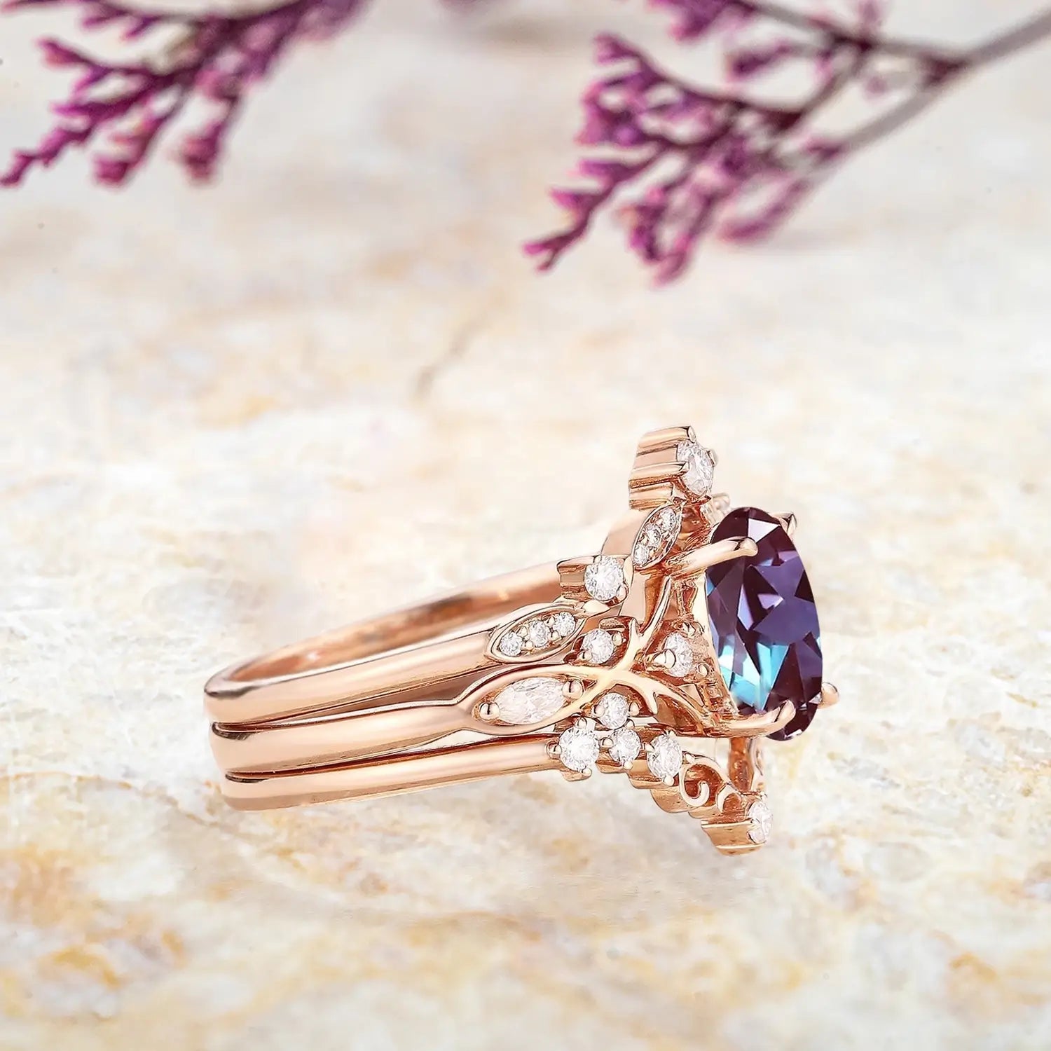 Side view of oval alexandrite ring with branch-inspired moissanite details