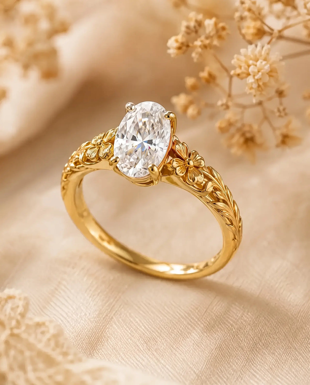 Avelune floral solitaire engagement ring featuring an oval lab diamond, sculpted gold flowers and textured leaf details.