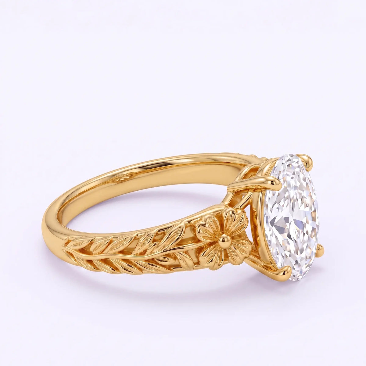 Angled side view of Avelune oval lab diamond ring showing a sculpted gold flower, veined leaf detailing and prong setting.right