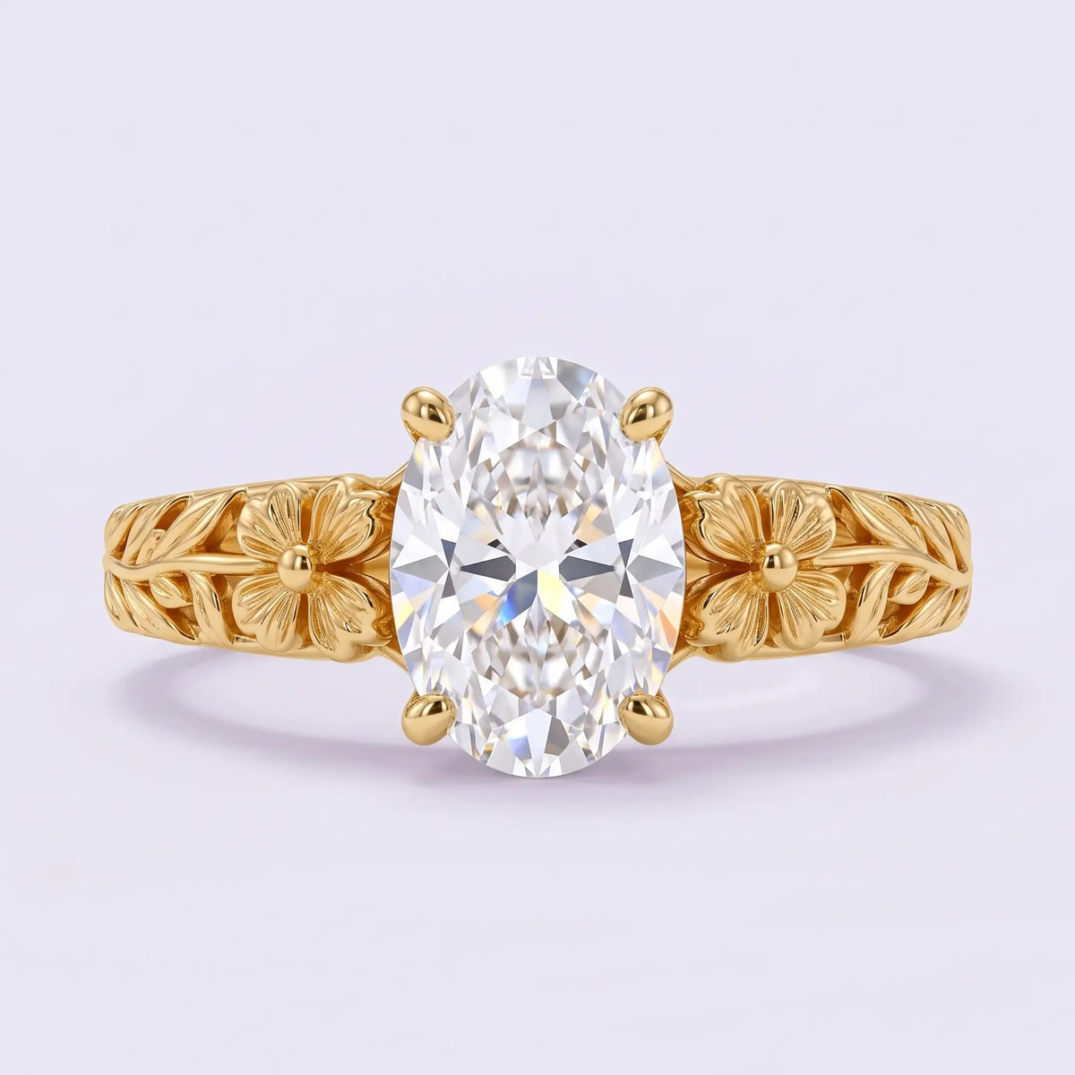 Front view of Avelune floral solitaire engagement ring showing an oval lab diamond between matching gold flowers and leaf shoulders.