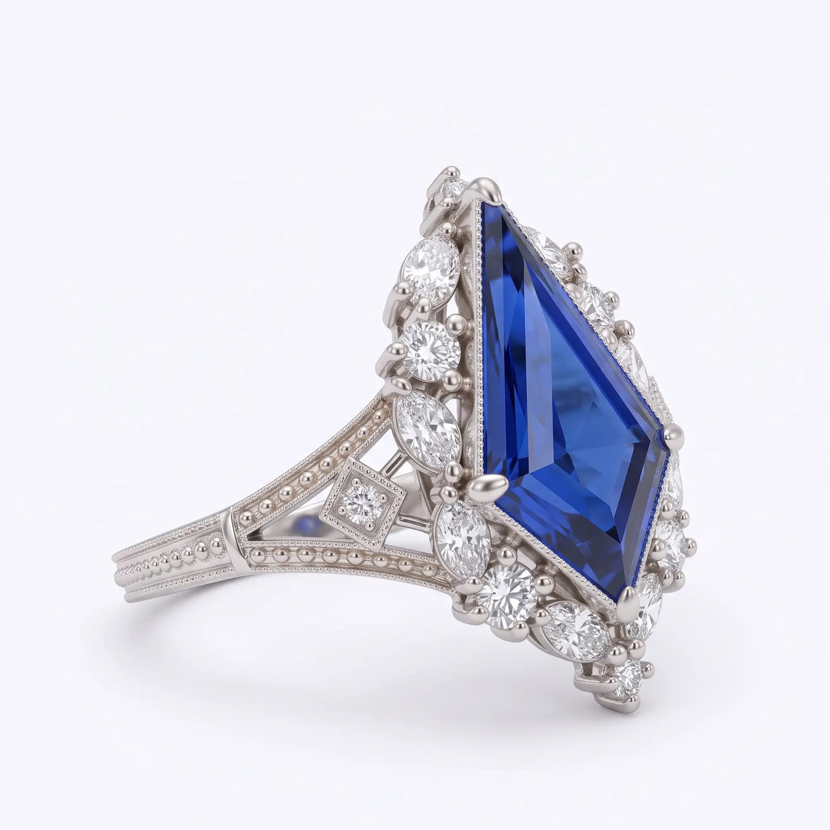 Right side view of Elarisse Edwardian-inspired lab sapphire halo ring highlighting its elongated kite setting, diamond-shaped filigree and antique-style metalwork.