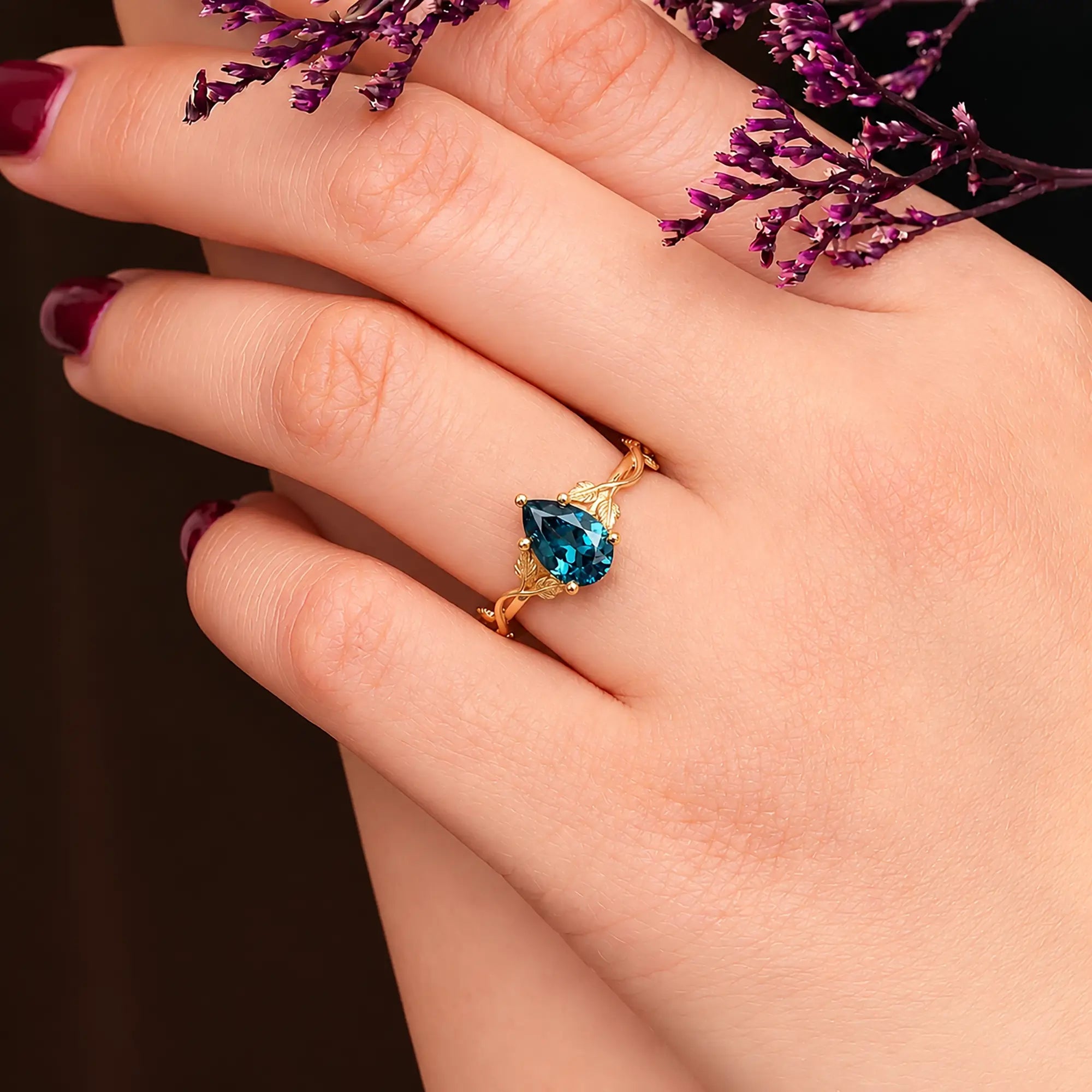 Elariv pear cut alexandrite leaf engagement ring in gold, minimalist nature inspired solitaire June birthstone ring for women